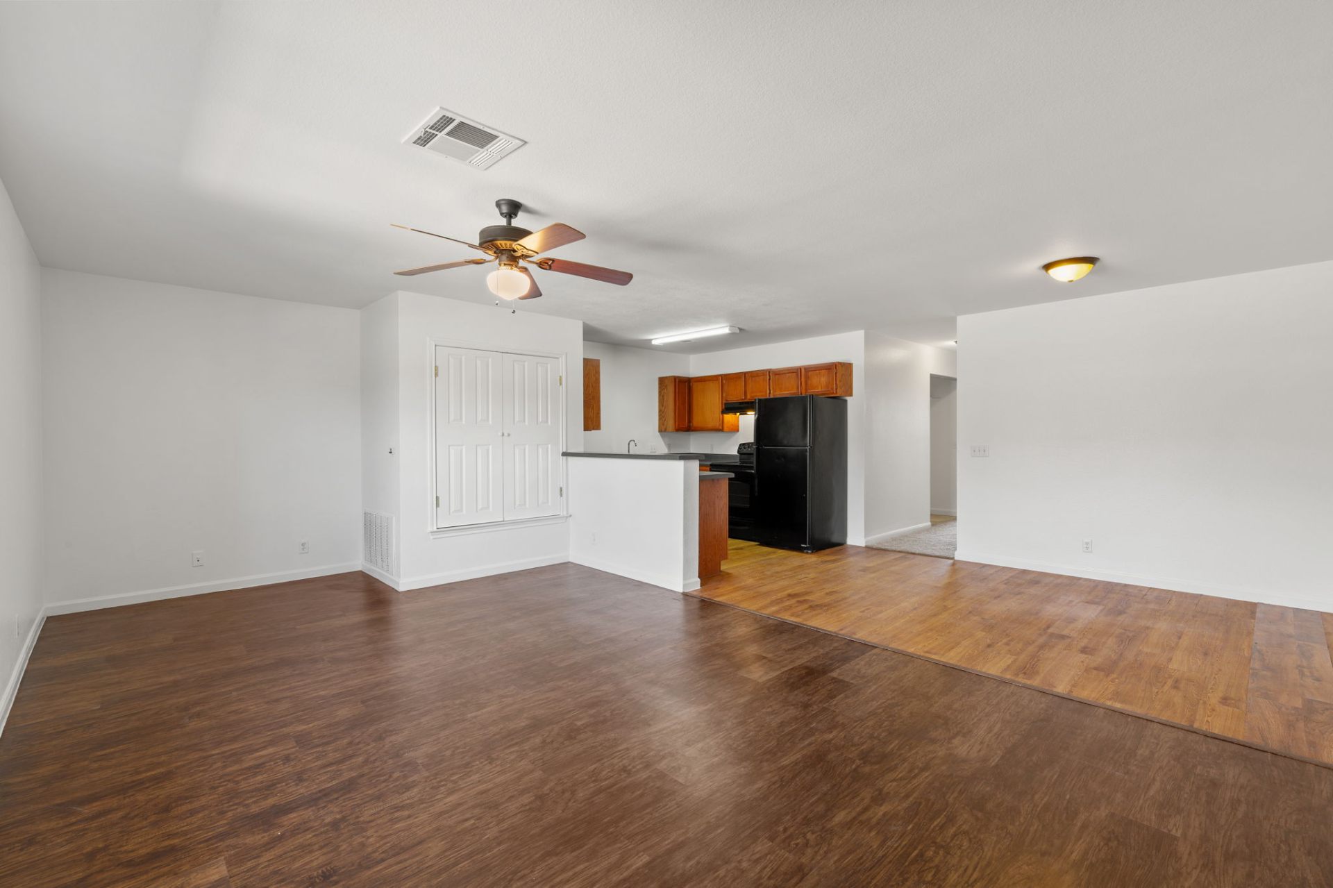 Classic-finish living and dining area open to the oak kitchen
