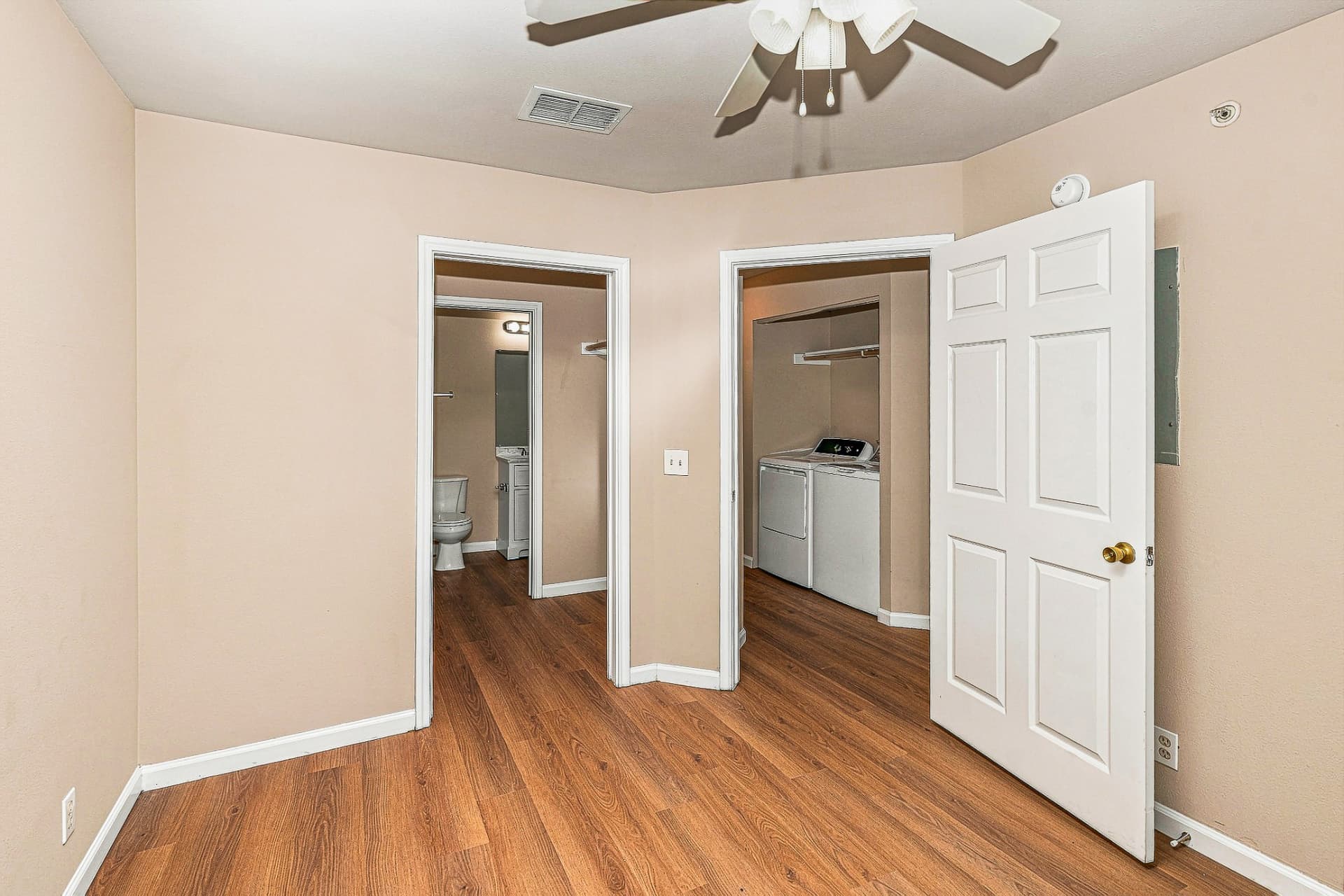 Renovated bedroom looking toward the bathroom and laundry area