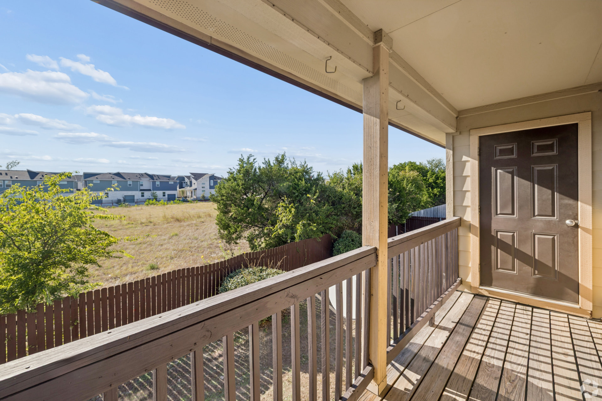 Upstairs covered balcony overlooking the open field