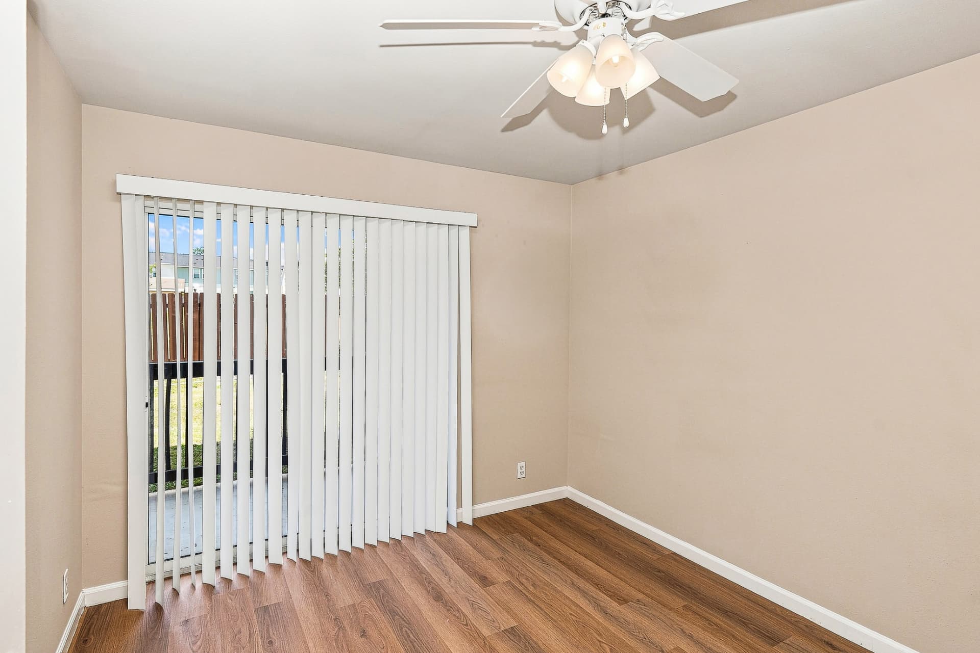 Renovated bedroom with sliding glass door to the private patio