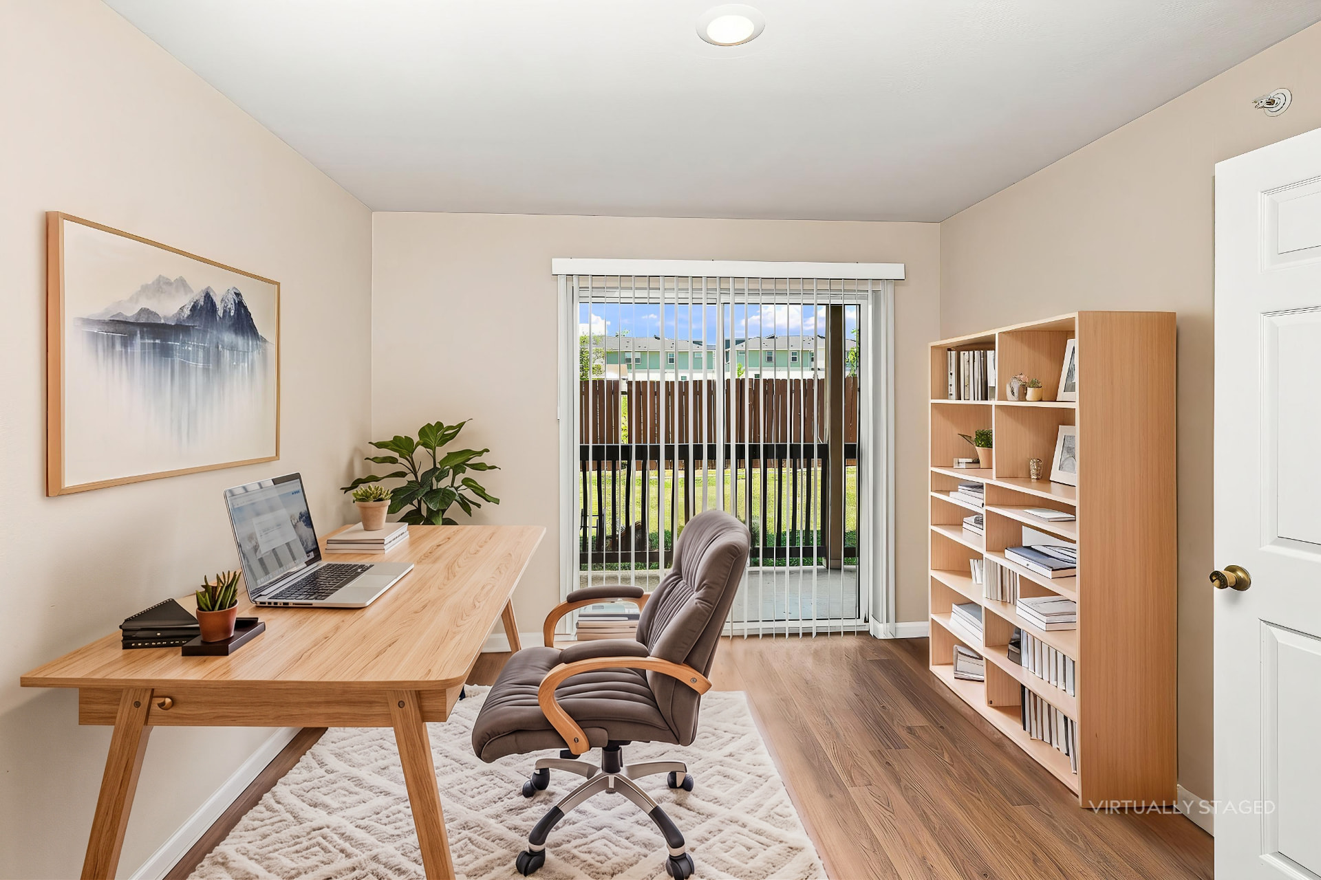Renovated flex room styled as a home office (virtually staged)